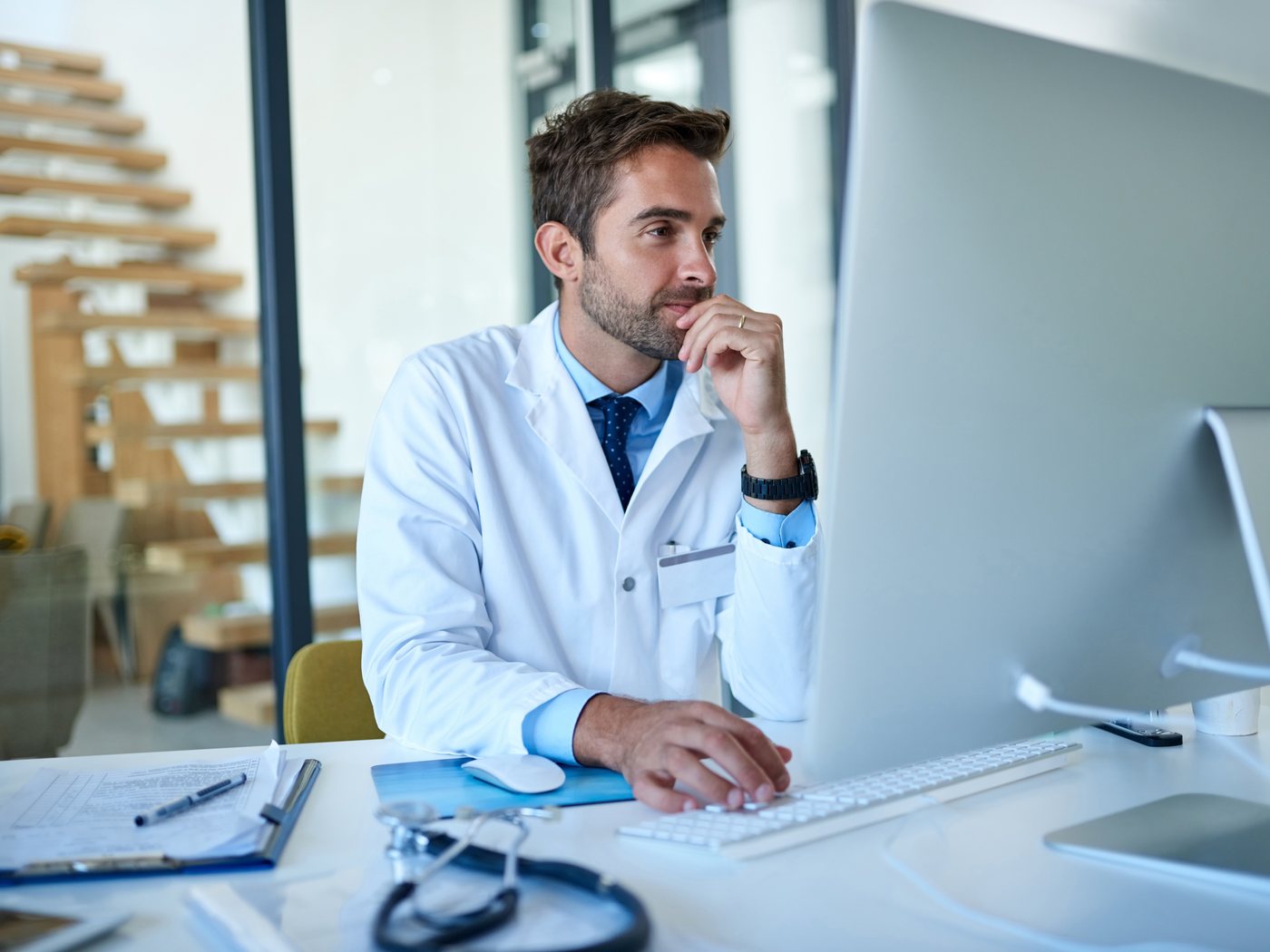 Board-certified physician reviewing a patient's telehealth intake and treatment plan